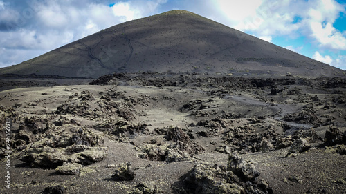 Volcano with lava fields in...