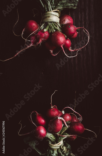 Overhead view of radishes on wooden table