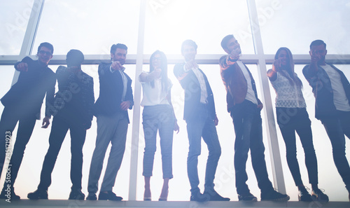 group of young business people pointing at you