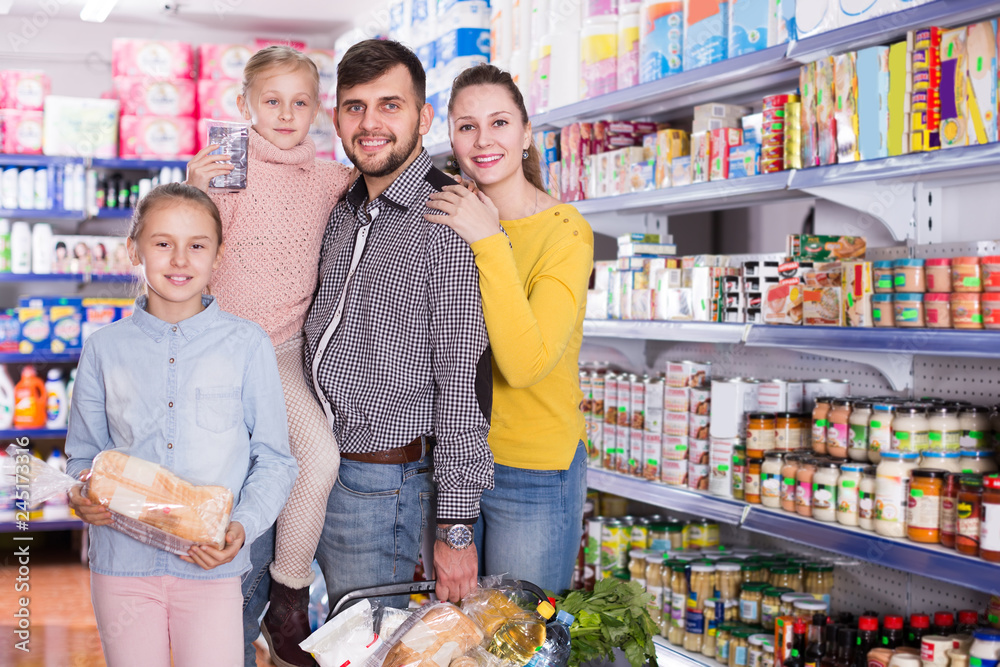 parents with two sisters holding full basket