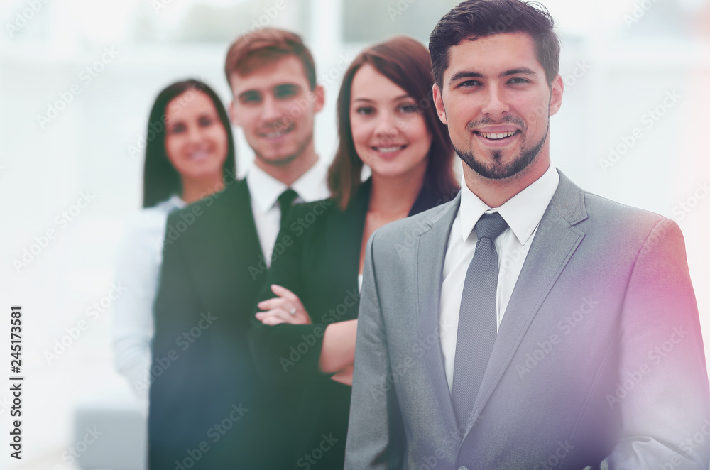 leader and the business team standing one behind the other.