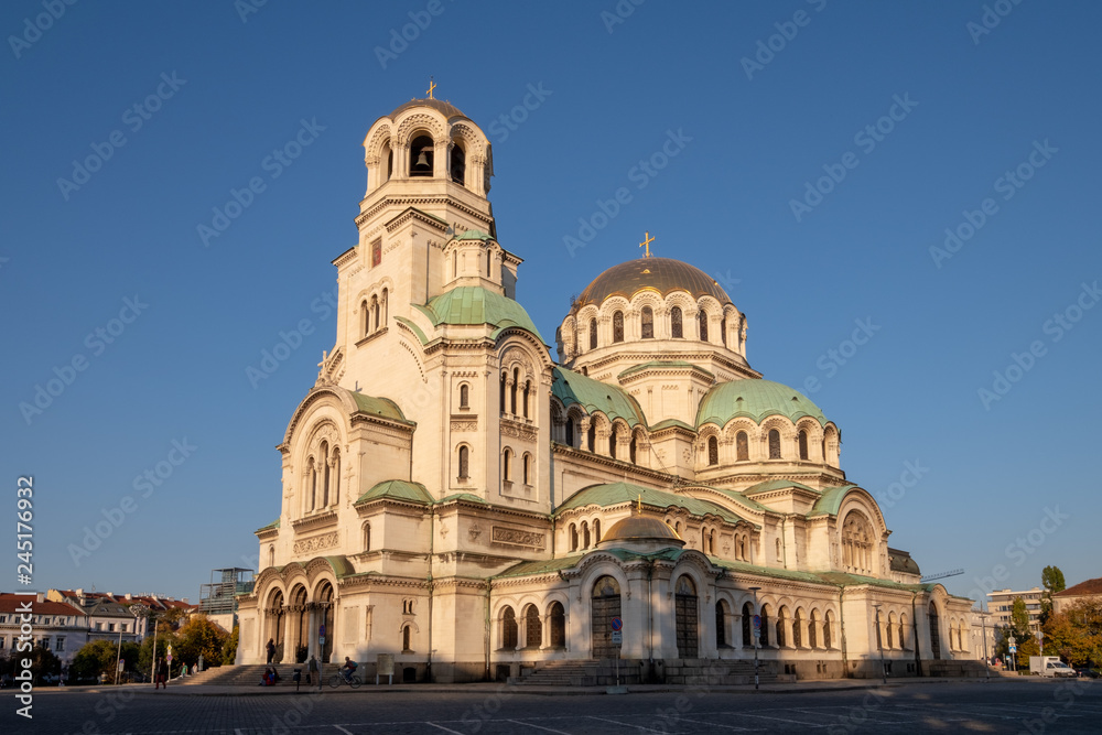 Side view of Alexander Nevsky Orthodox Cathedral of Sofia, Bulgaria under a blue sunny sky