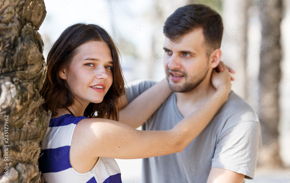 Fototapeta premium Man and girl talking and hugging