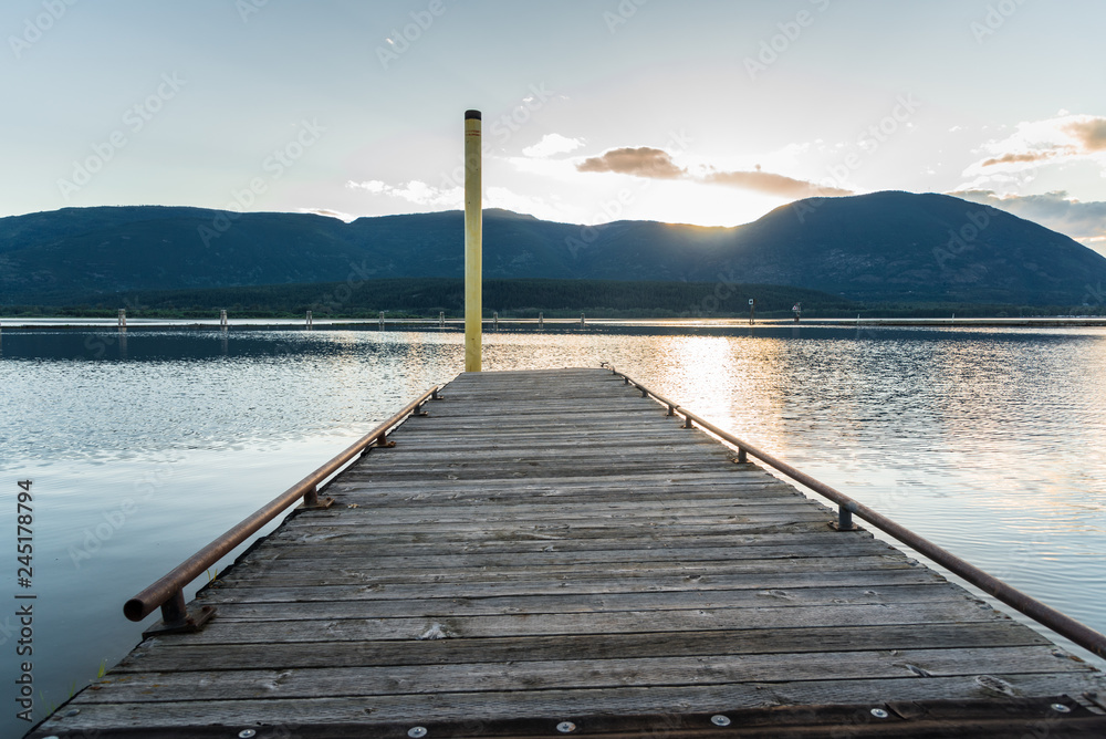 Deserted Jetty on a Scenic Mountain Lake at Sunset. Salmon Arm, BC, Canada.