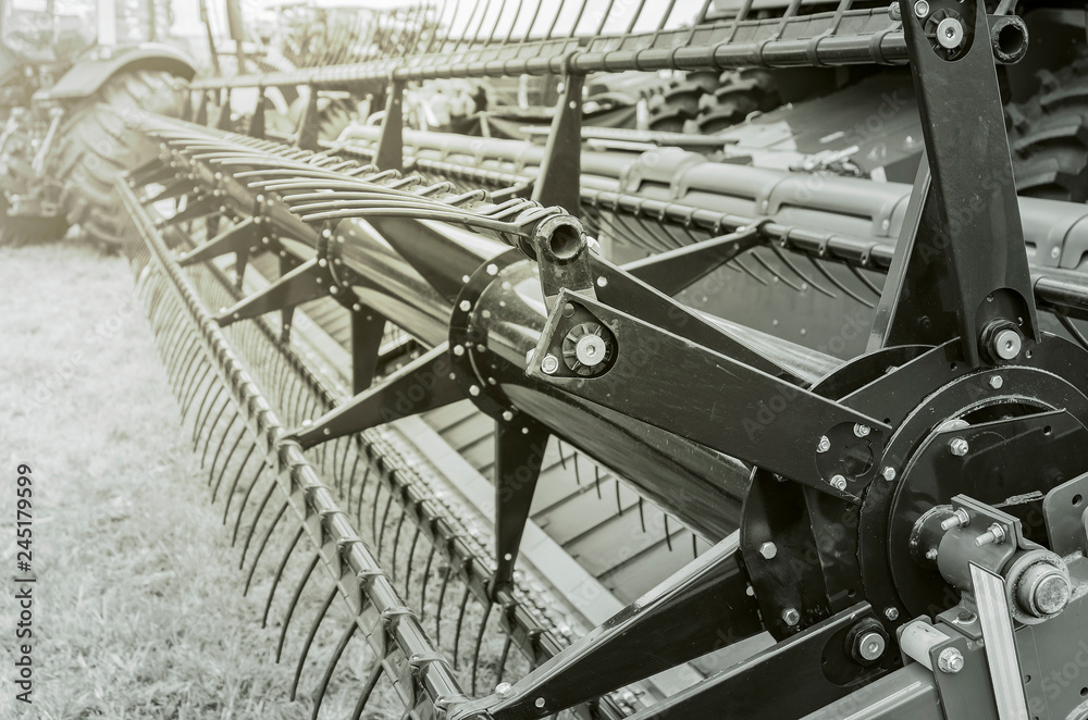 Fototapeta premium Grain harvester machine. Tractor that harvest soy grains. Close up. 