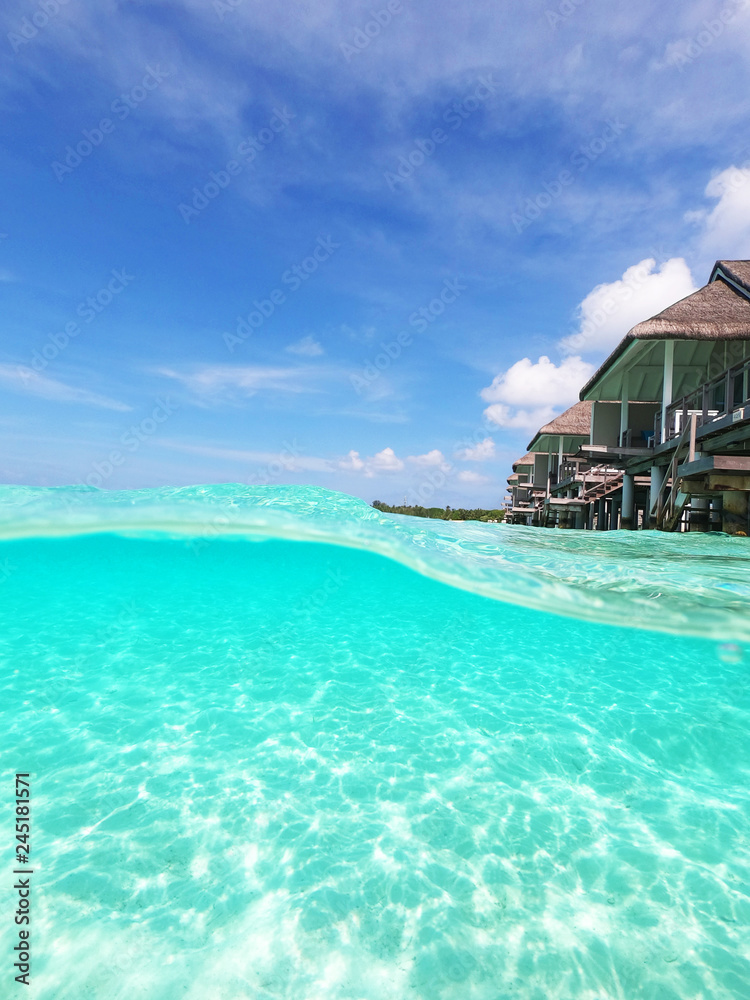 water villas on a tropical island, photo taken from water
