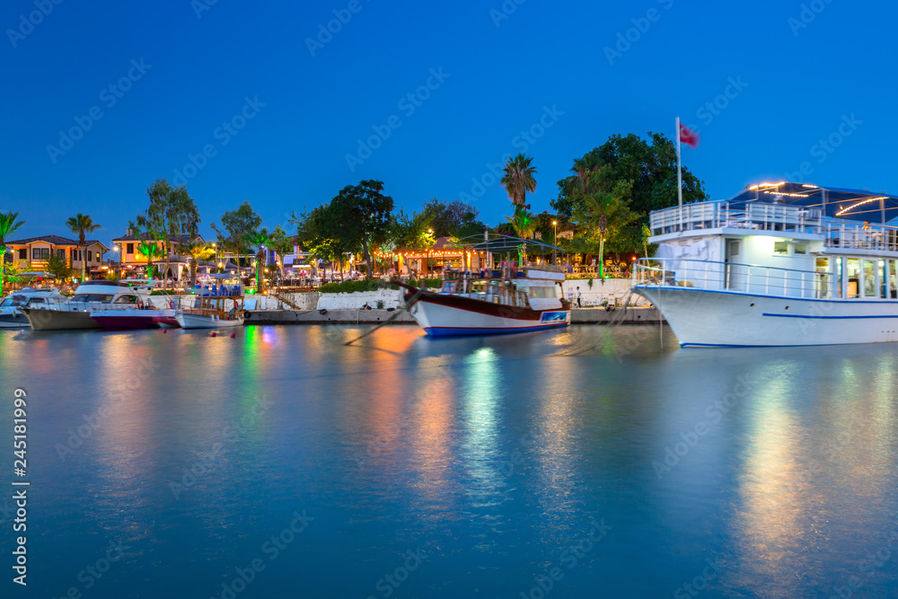 The harbour with boats in Side at night, Turkey