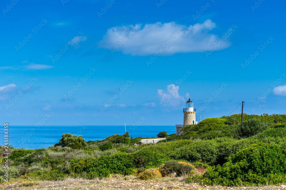 Greece, Zakynthos, Beautiful north cape skinari lighthouse in green scenery