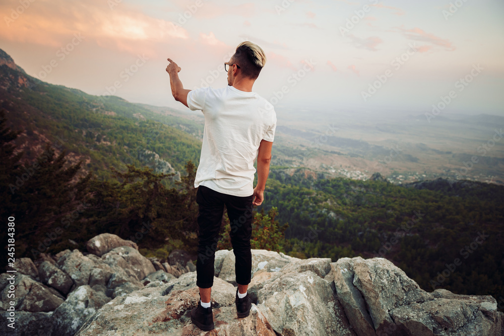 Guy on top of a mountain Guy on top of a mountain