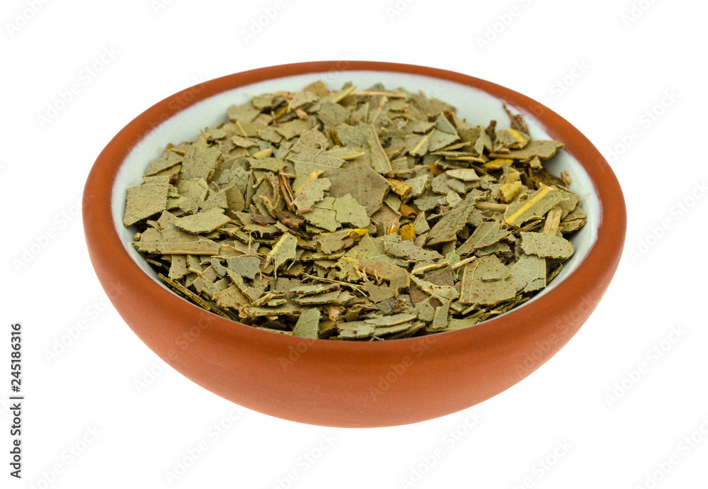 Small bowl filled with eucalyptus leaf on a white background Small bowl filled with eucalyptus leaf on a white background