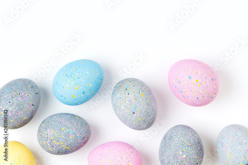 Background with pale pink, blue, yellow and gray Easter eggs. Compositions in pastel colors. Easter concept