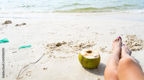 Summer holidays on the Phu Quoc island with coconut,legs and sea on beautiful white sand with crystal clear sea as a travel concept background photo