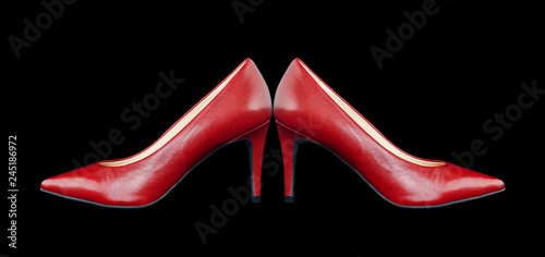 Red women's shoes on a black background