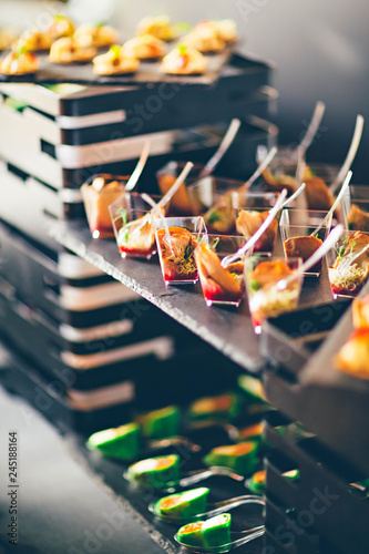 Snack on black slate in a buffet. Event catering concept.