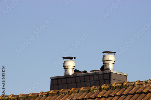 chimney on roof with blue sky