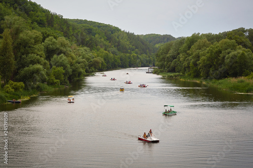 Boats on the Seversky Donets river, Holy Mountains and Sviatogorskaya Lavra at Sviatogorsk. photo