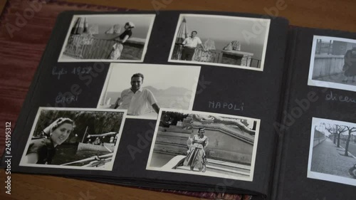 Slow overview of vintage photo album with family FDV