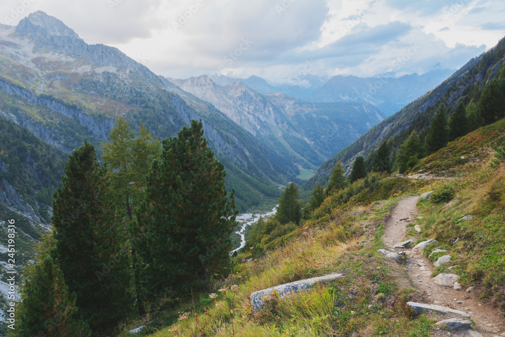 Mountains in the Swiss Alps with glaciers, rivers and distant mountain valleys.