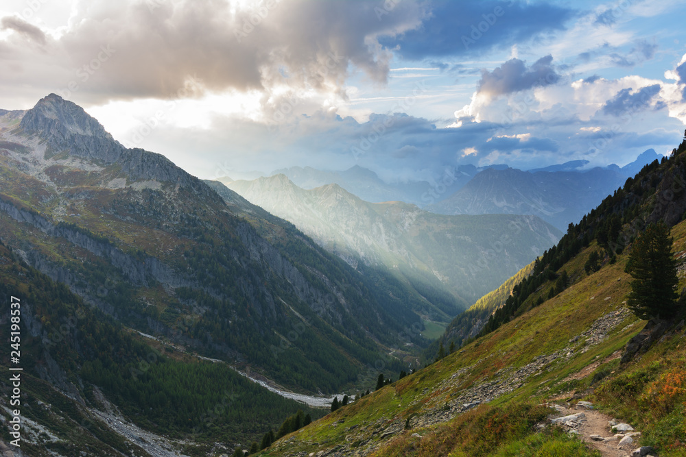Mountains in the Swiss Alps with glaciers, rivers and distant mountain valleys.