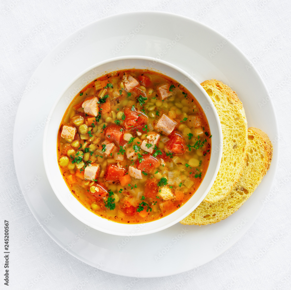 green pea soup with pork and tomato served with corn bread green pea soup with pork and tomato served with corn bread