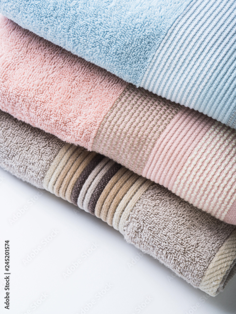 Pastel color clean folded towels on white Pastel color clean folded towels on white