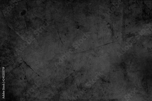 Dark black grunge rough textured concrete stone wall background