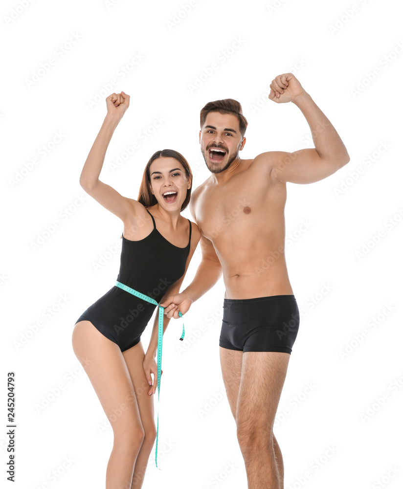 Fit people with measuring tape on white background. Weight loss Fit people with measuring tape on white background. Weight loss