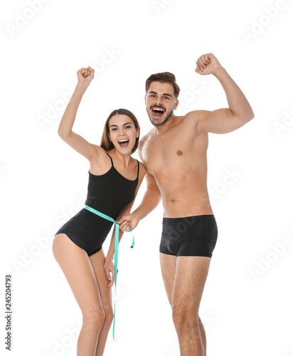 Fit people with measuring tape on white background. Weight loss