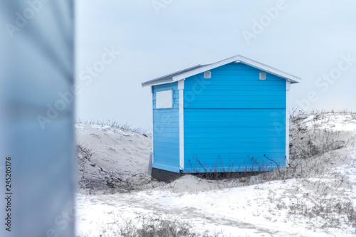 Little blue beach hut in snow and winter weather in Tisvilde, Denmark. Taken at the beach of Tisvildeleje. © Mads Øland-Petersen