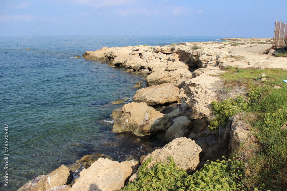 Seaside. Turquoise beautiful water. Clear blue sky. Cyprus, Paphos, Mediterranean sea.