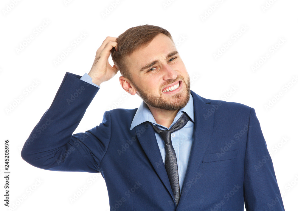 Young man scratching head on white background. Annoying itch Young man scratching head on white background. Annoying itch