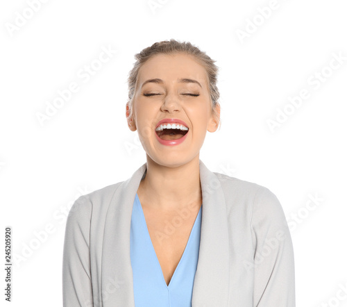 Portrait of young businesswoman laughing on white background