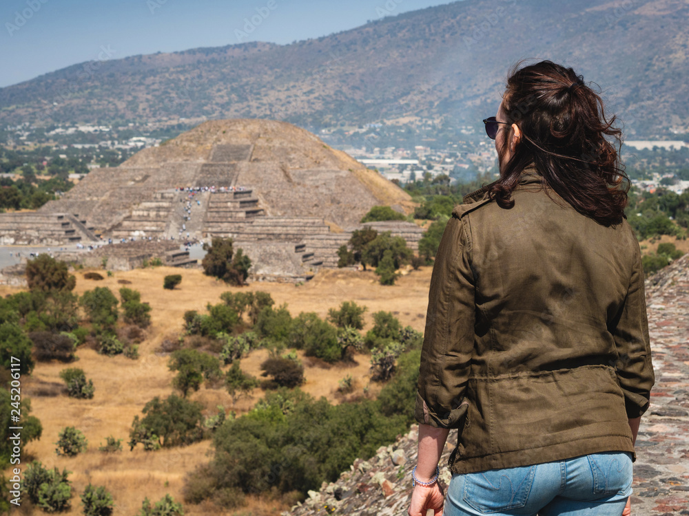 Naklejka premium Tourist at Looking at View at the Ancient Aztec City of Teotihuacan, Mexico