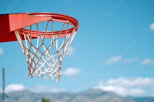 basketball hoop on background of blue sky