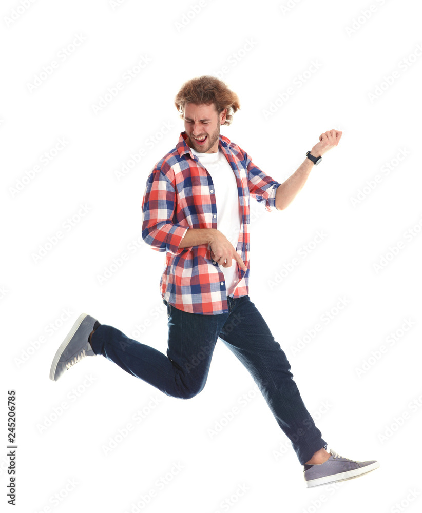 Obraz premium Young man playing air guitar on white background