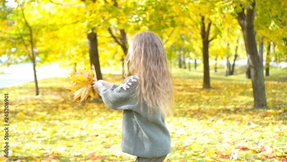 Portrait of adorable little girl with yellow leaves bouquet in fall Portrait of adorable little girl with yellow leaves bouquet in fall