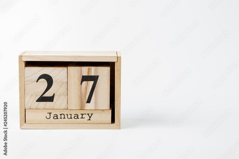 Wooden calendar January 27 on a white background Wooden calendar January 27 on a white background