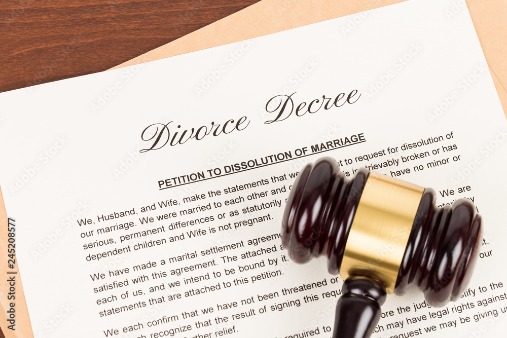 Wooden judge gavel and divorce decree; document is mock-up