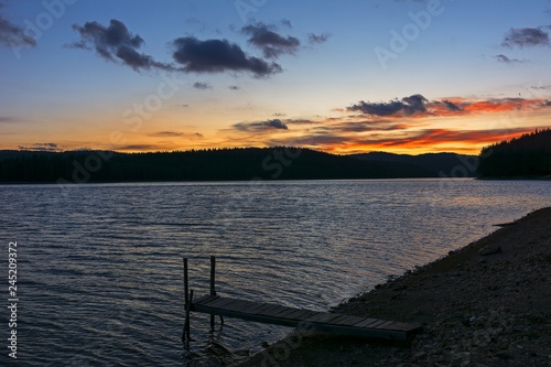 sunset over mountain lake