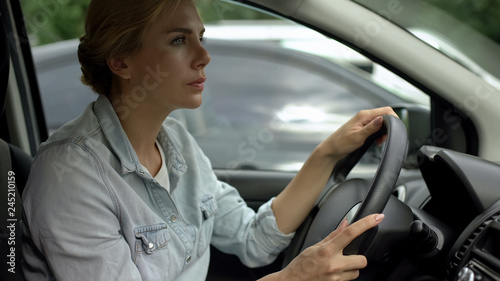 Unbelted woman driving car, risk of accident, traffic rules and regulations © motortion