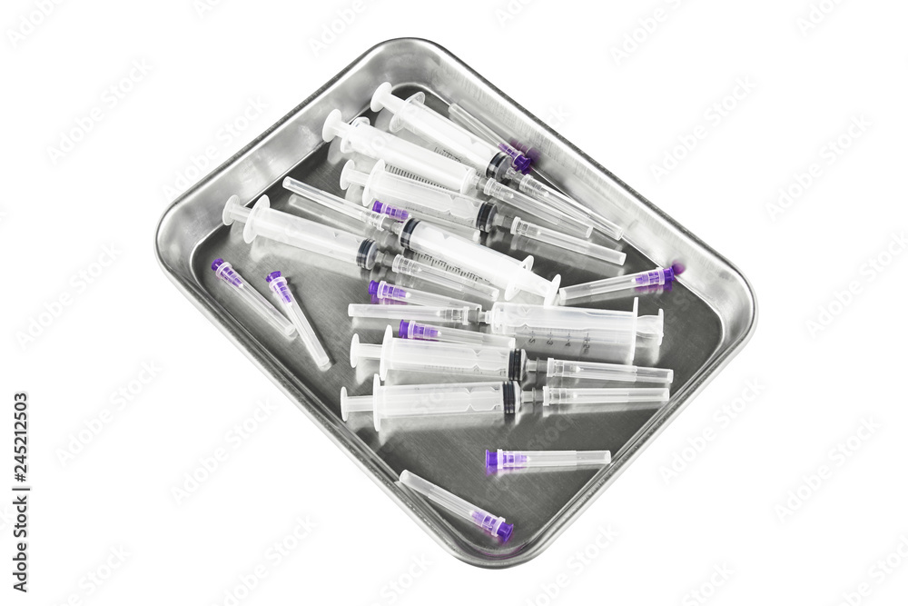 Metal salver with syringes and needles. Isolated on white background Metal salver with syringes and needles. Isolated on white background