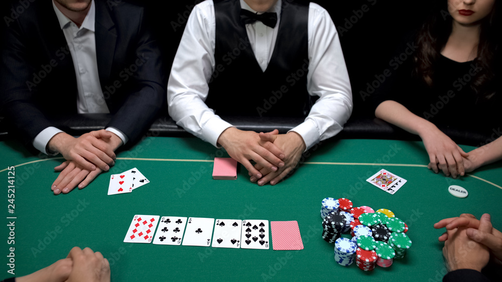 Business people gambling at casino, risky poker game, upper class entertainment Business people gambling at casino, risky poker game, upper class entertainment