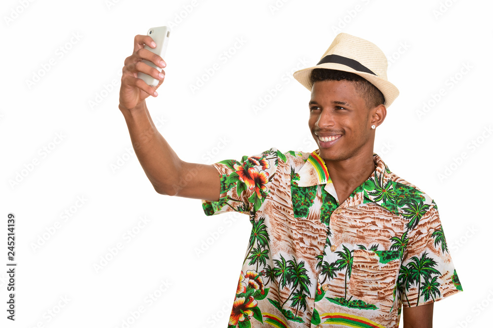 Young happy African man taking selfie with mobile phone ready fo Young happy African man taking selfie with mobile phone ready fo