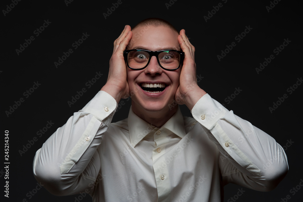 Obraz premium Happy young businessman is laughing