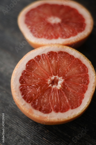 Close up freshly harvested grapefruit on wooden background