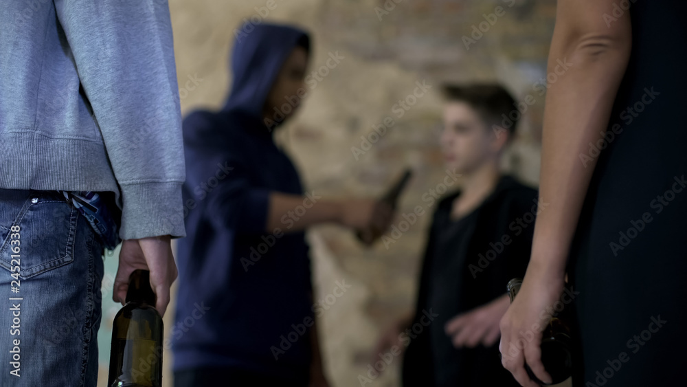 Schoolboy forcing friend to drink alcohol, initiation into gang, bad influence