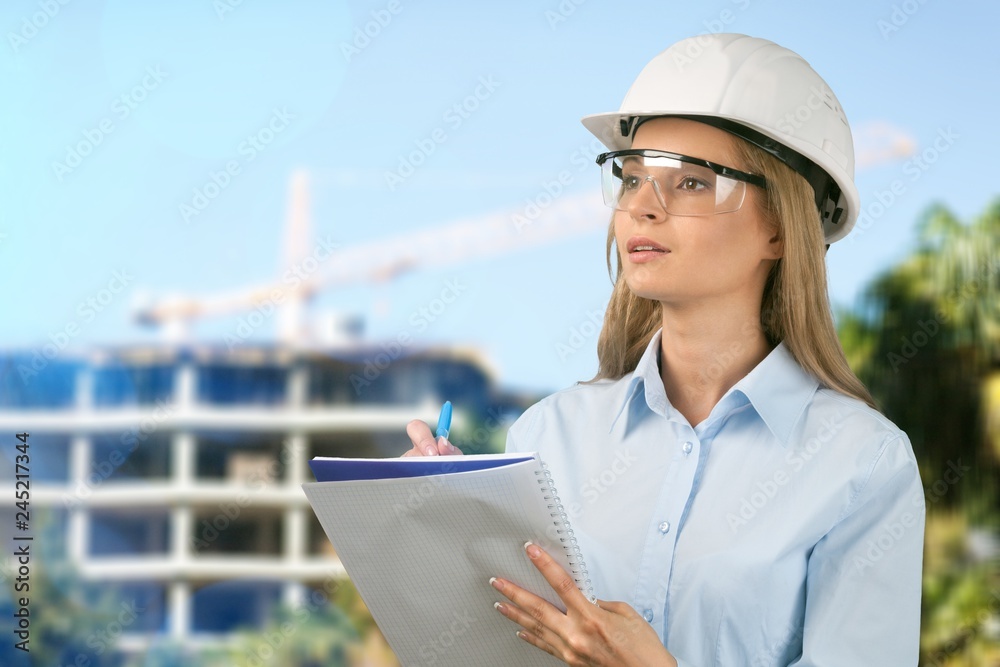 Beautiful woman engineer with document Beautiful woman engineer with document