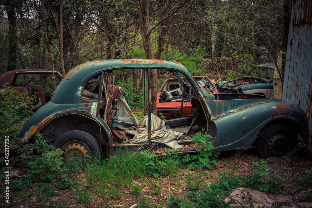 Destroyed and abanoded car in an abandoned place