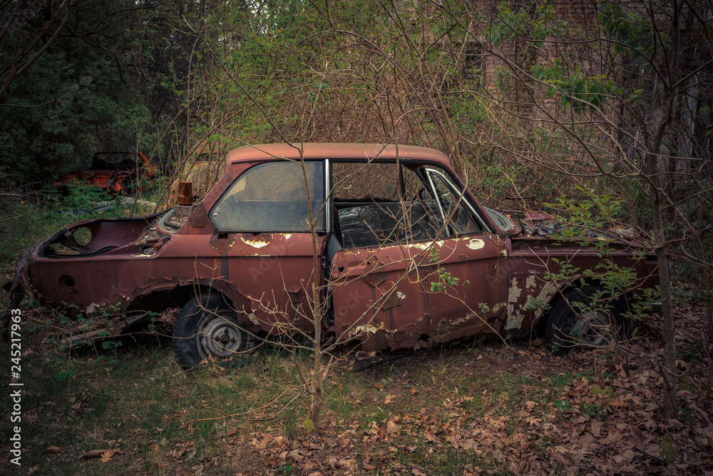 Destroyed and abanoded car in an abandoned place Destroyed and abanoded car in an abandoned place