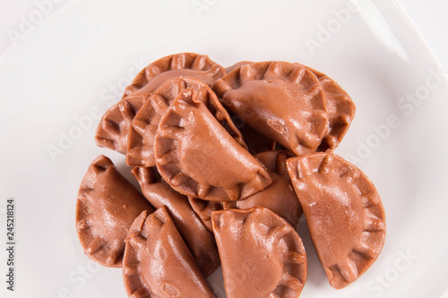 Traditional polish dumplings called pierogi - chocolate flavour with cheese